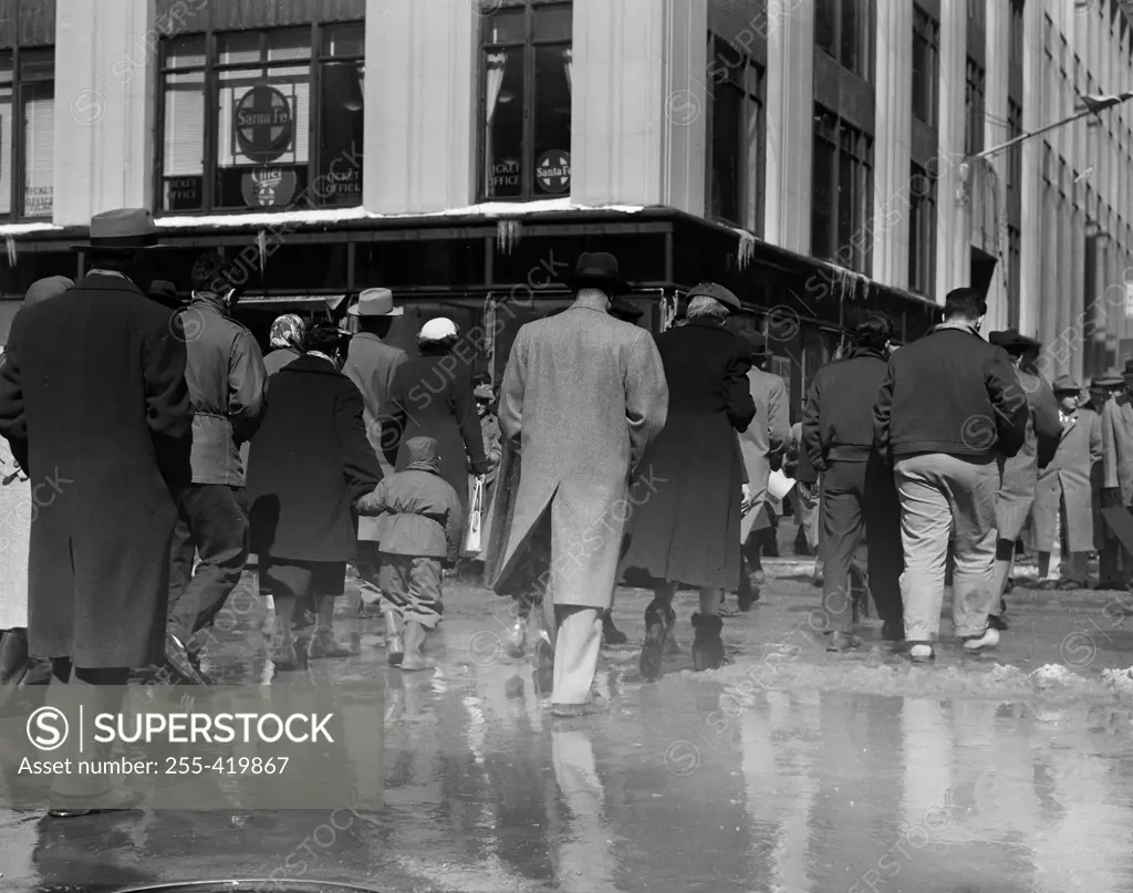 USA, New York State, New York City, Pedestrians waling in slush