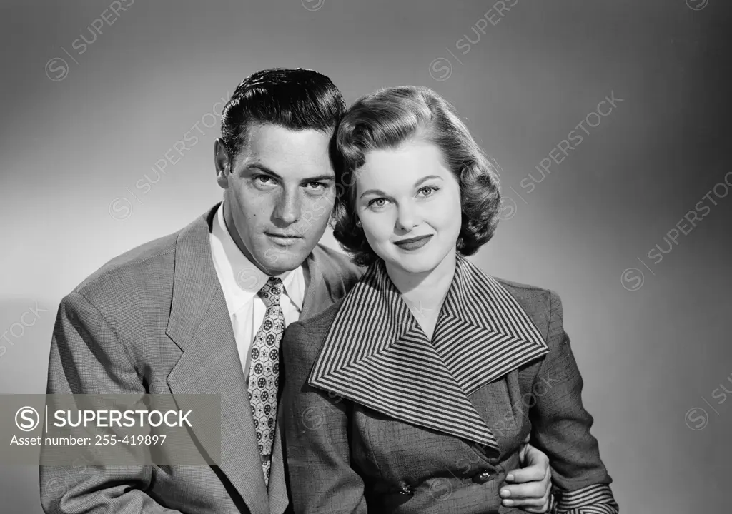 Portrait of young couple, studio shot