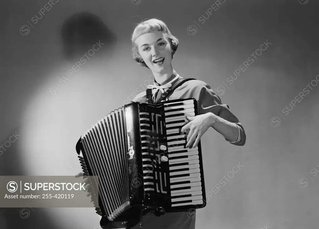 Young woman playing accordion