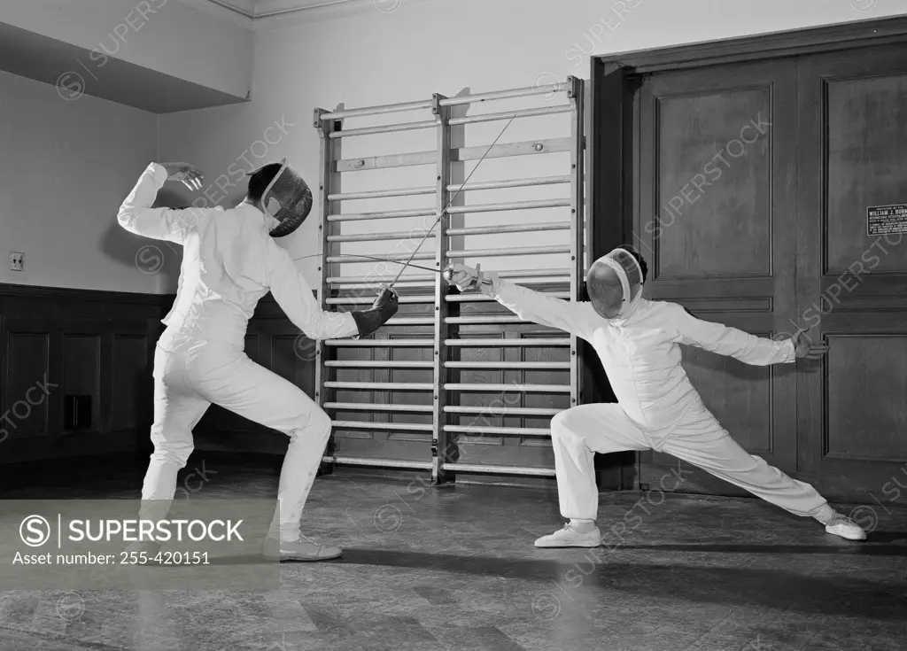 Two fencers fighting