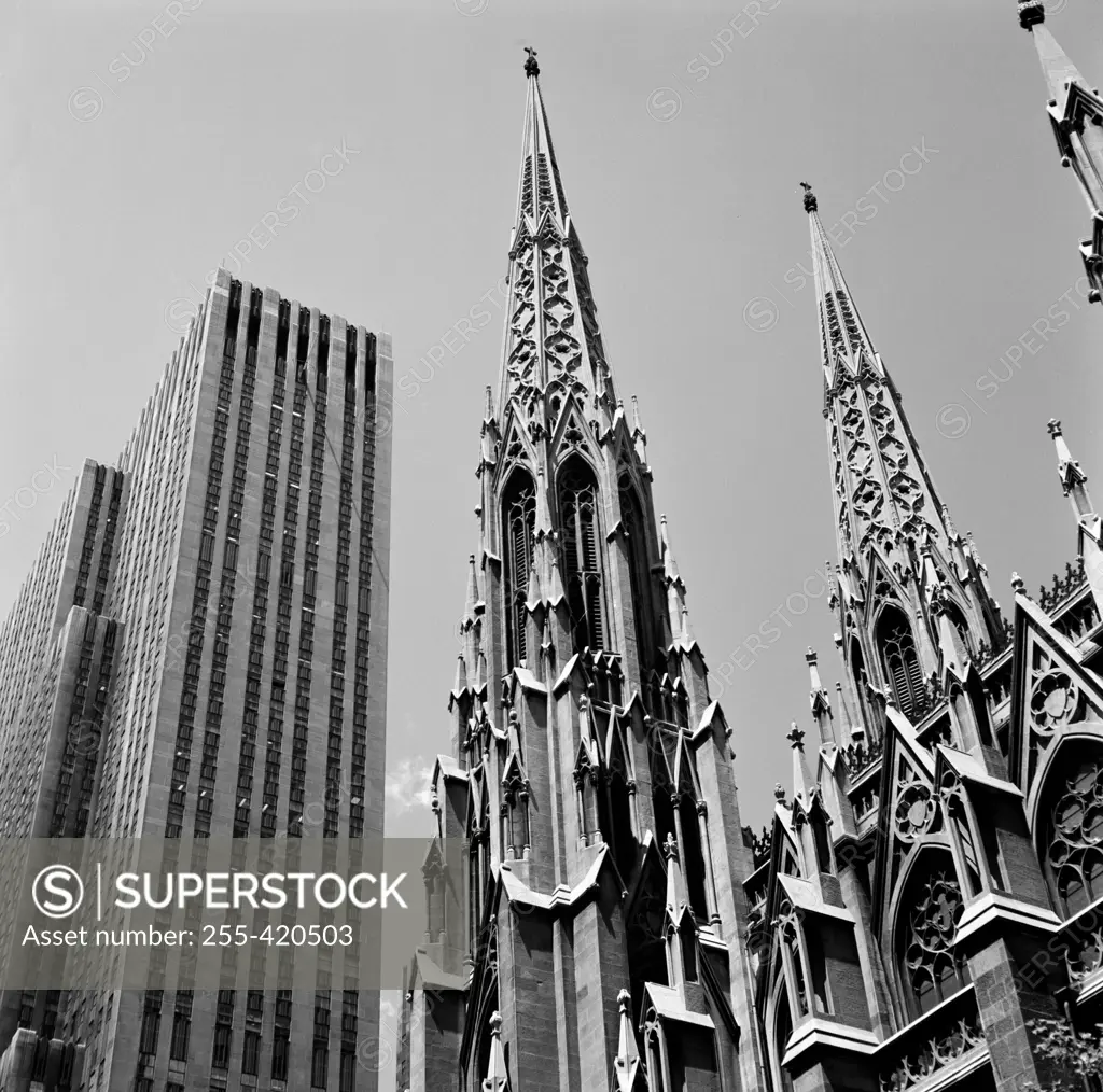 USA, New York City, Pinnacle of neogtohic church against modern skyline