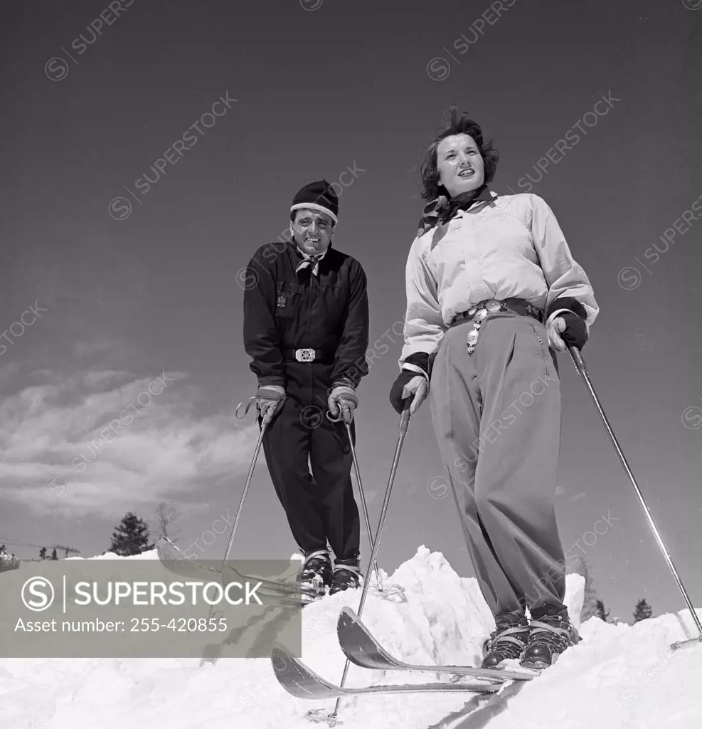 Portrait of couple skiing