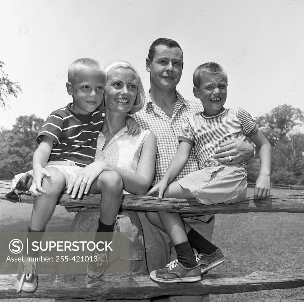 Family with two sons having barbecue