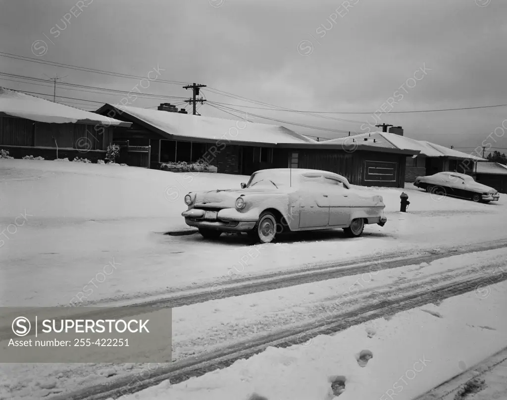 USA, Seattle neighborhood street with cars after snowfall