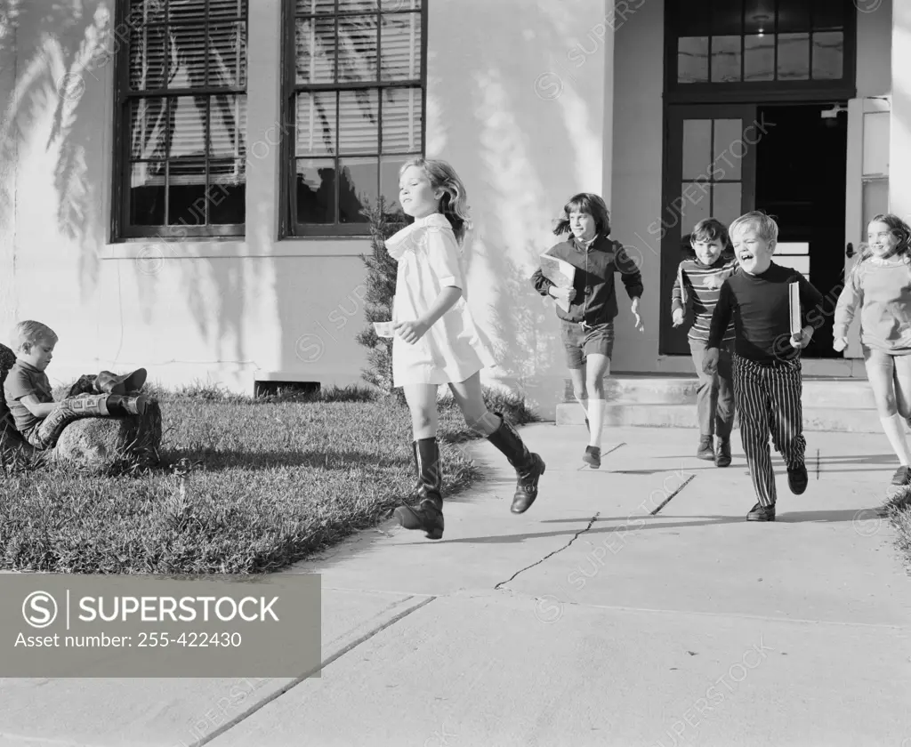 School children running around after school