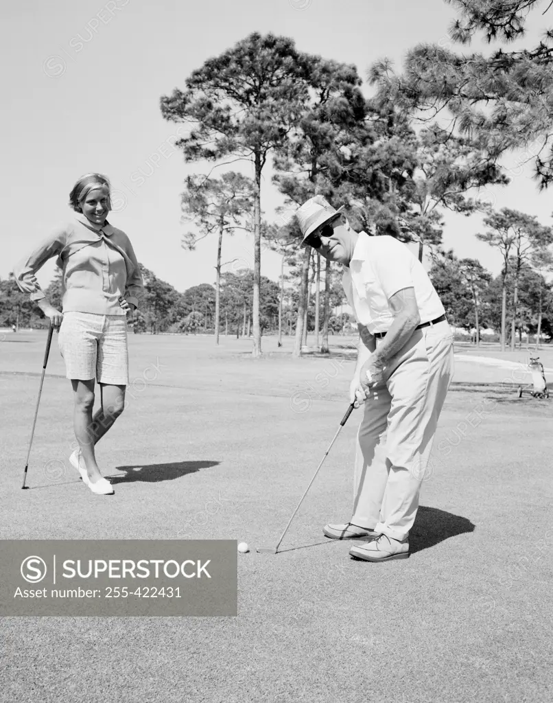 Couple playing golf