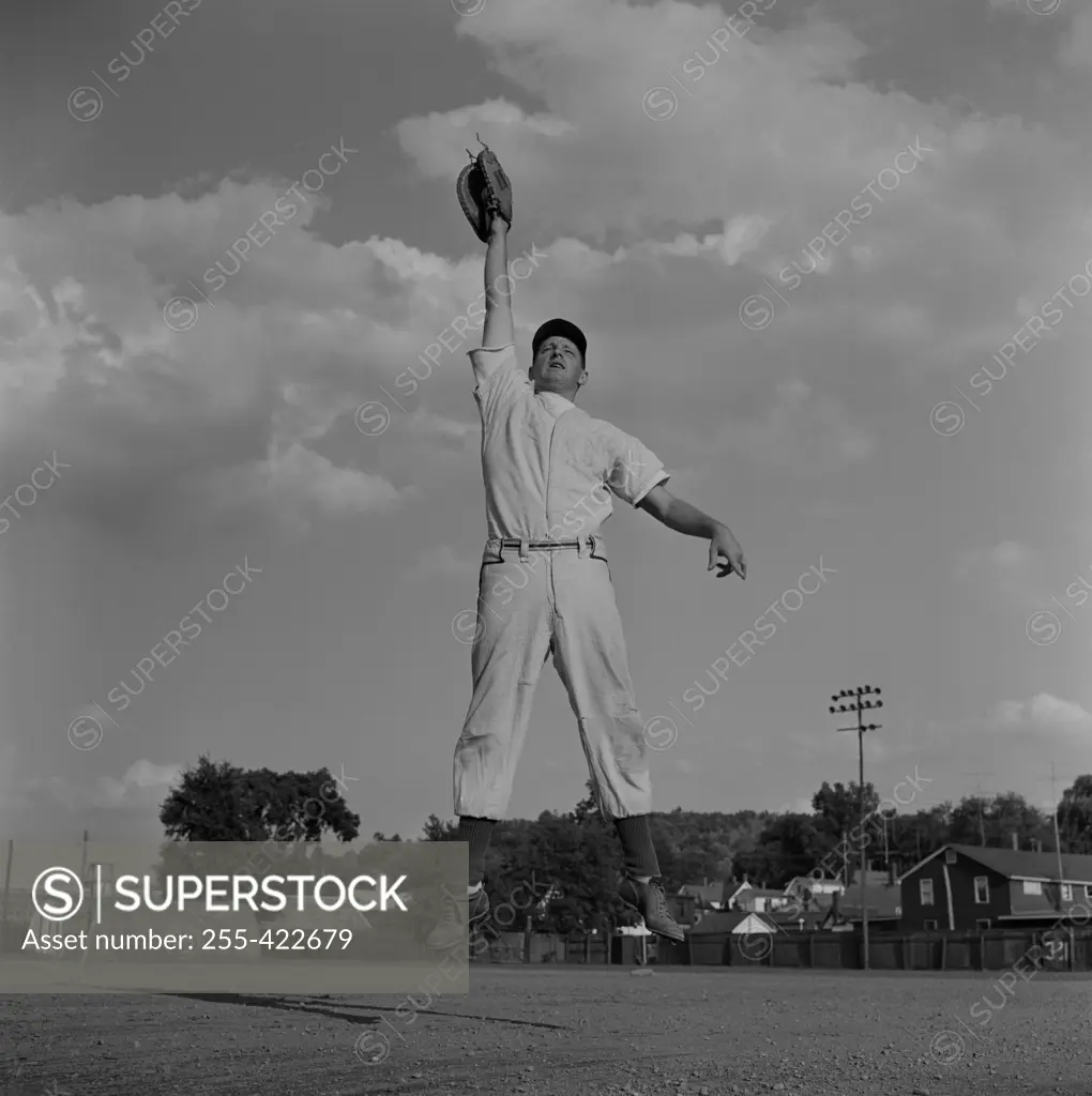 Baseball catcher jumping