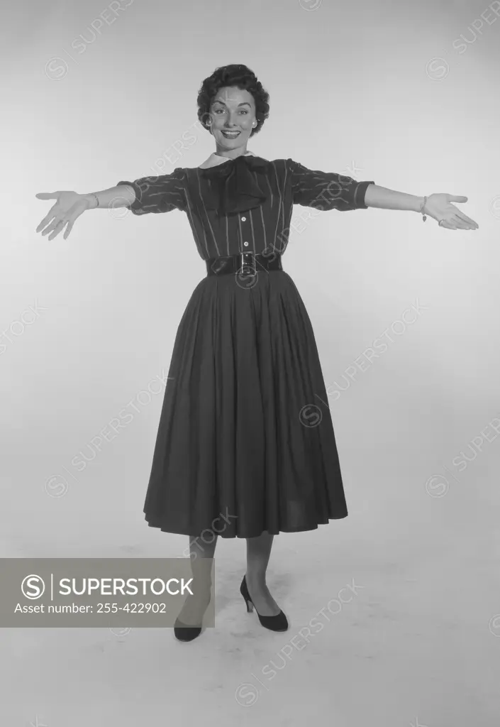 Studio Portrait of a mid adult woman gesturing