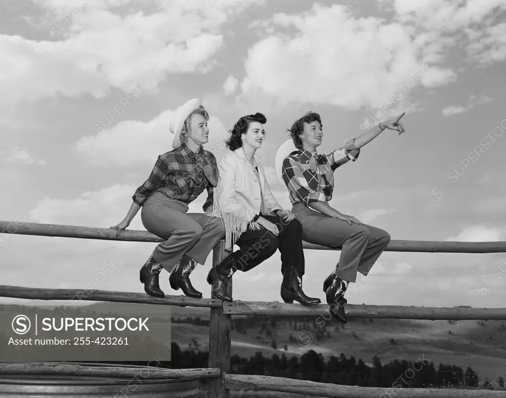 USA, Colorado, Evergreen, Dude Ranch, Lazy Valley Inn, Two cowgirls on porch