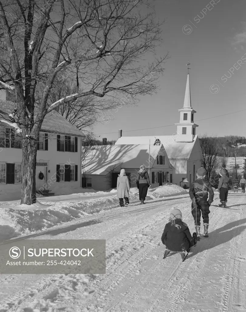 USA, Vermont, Waterford, Main Street with children going home from school