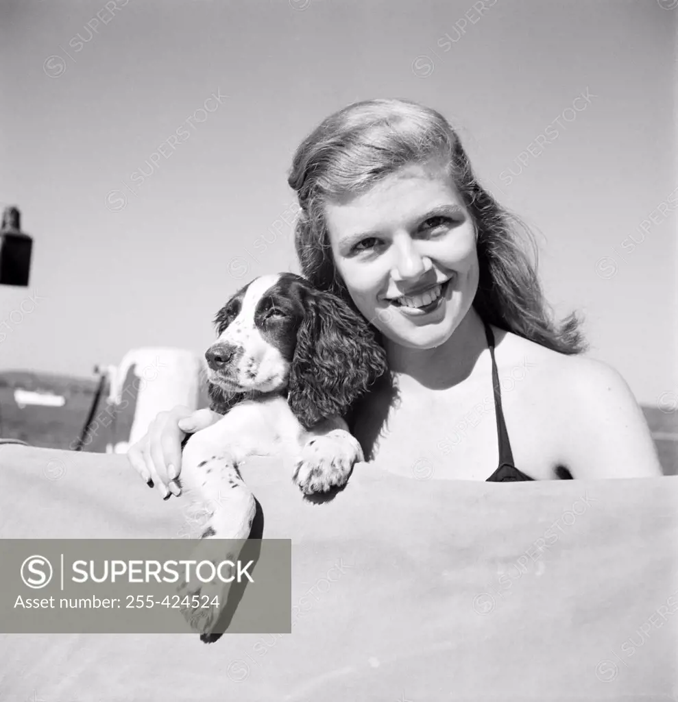 Portrait of young woman with dog