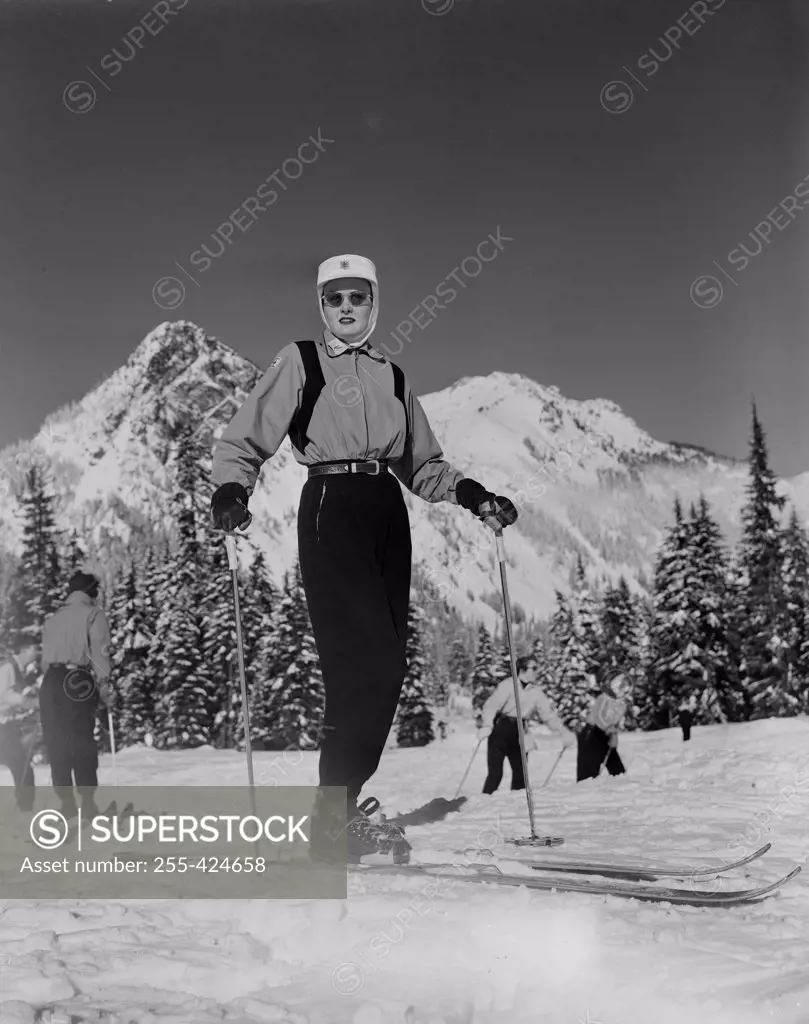 Ski Patrol woman with snowcapped mountains in background