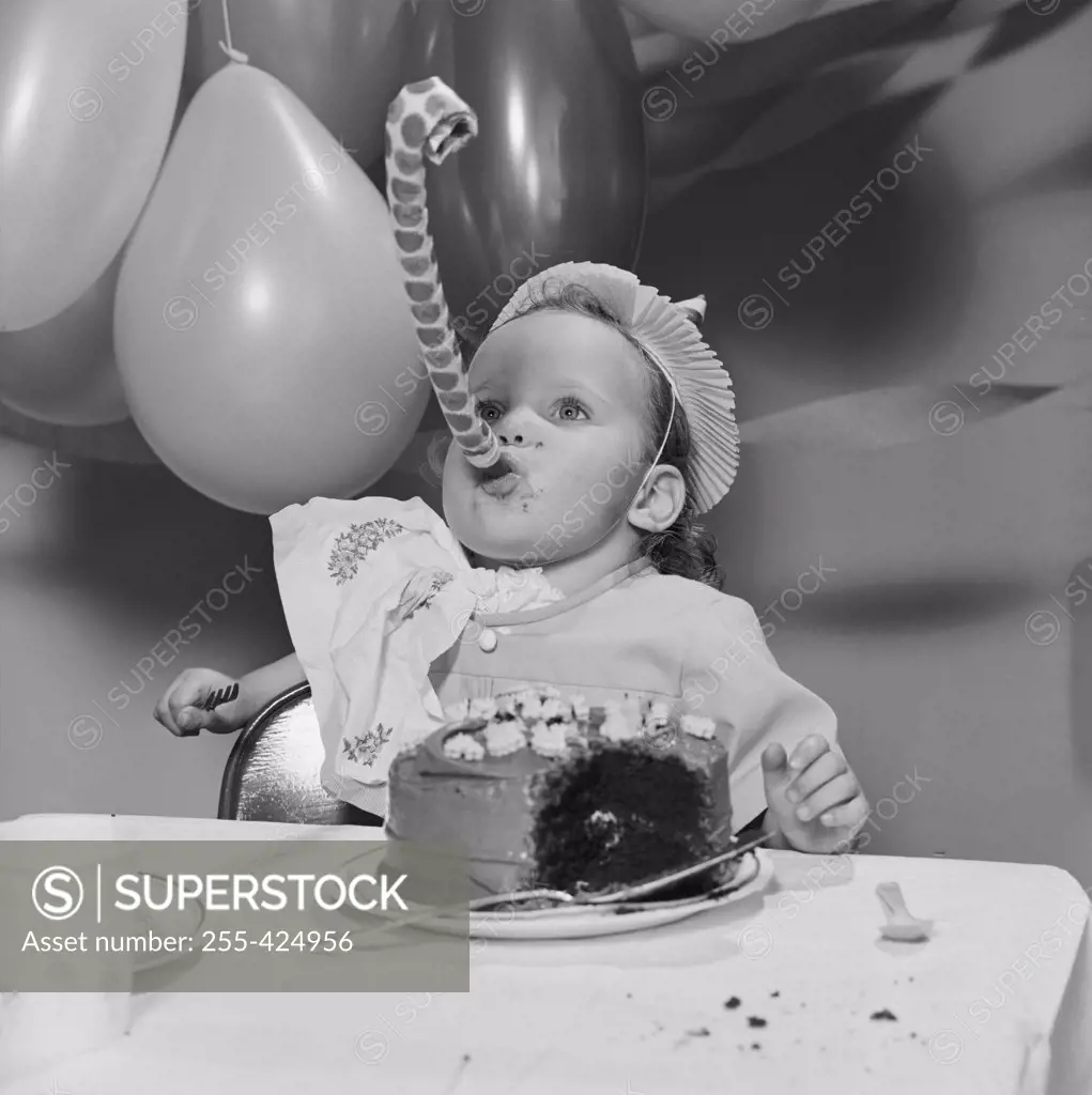 Baby girl with birthday cake