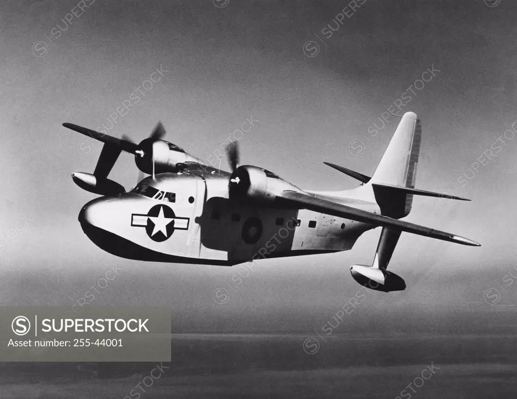 Side profile of a military airplane in flight, JR2F Albatross, US Navy