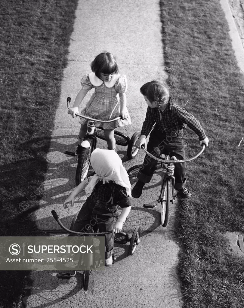 Children on tricycles