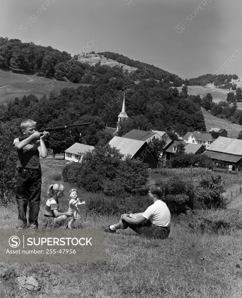 Children playing on hill