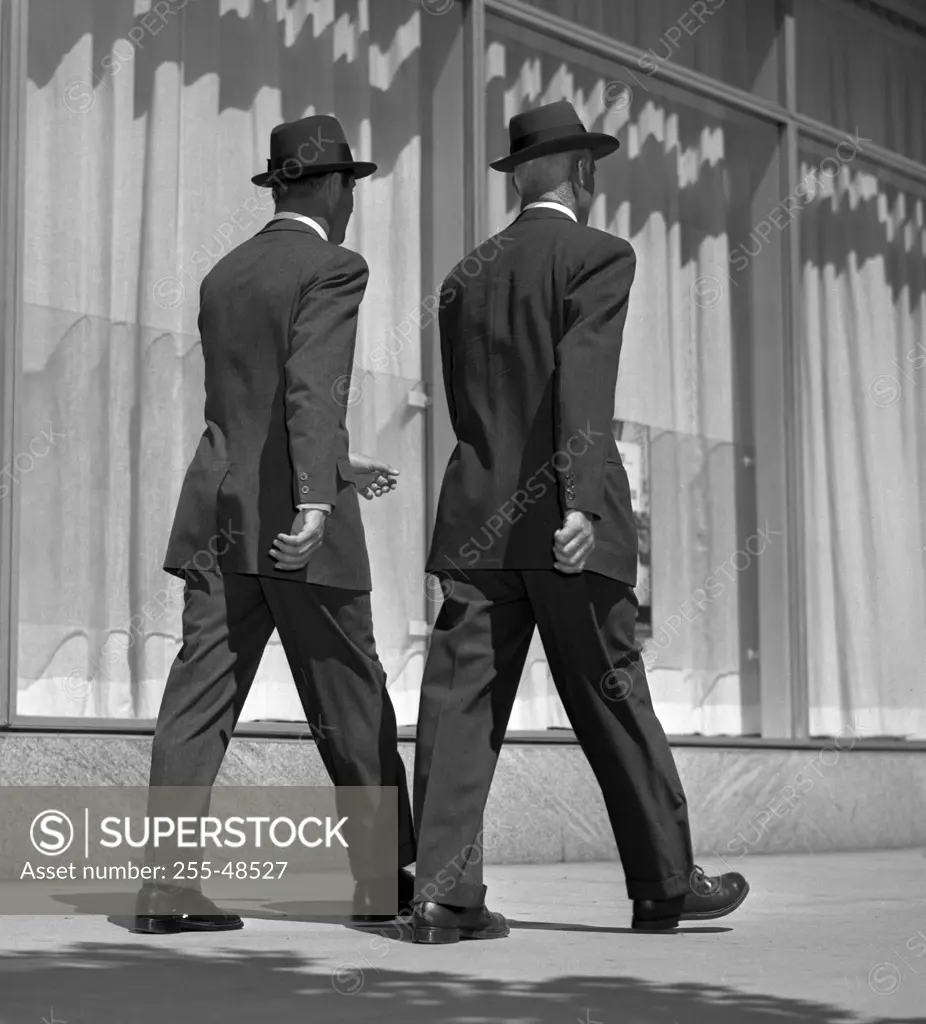 Two businessmen walking on street