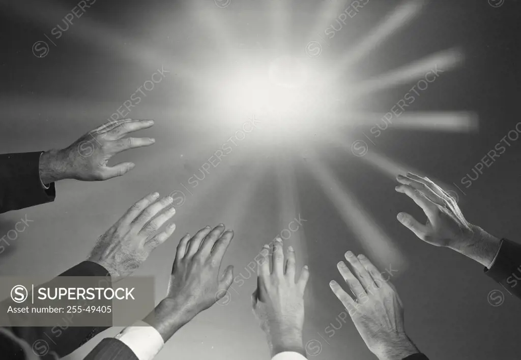 Vintage photograph. Close-up of people's hands raised