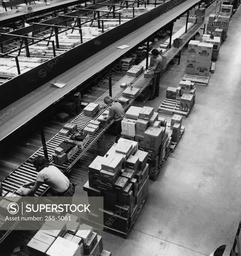 High angle view of manual workers working in a factory