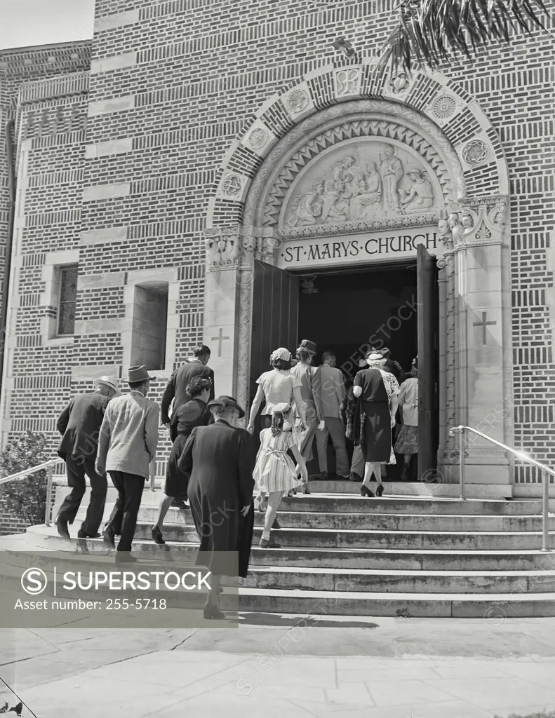 Vintage photograph. Rear view of a group of people entering a church, St. Mary's Church, St. Petersburg, Florida, USA