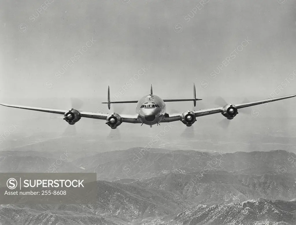 Vintage Photograph. Head on view of Lockheed Constellation in flight