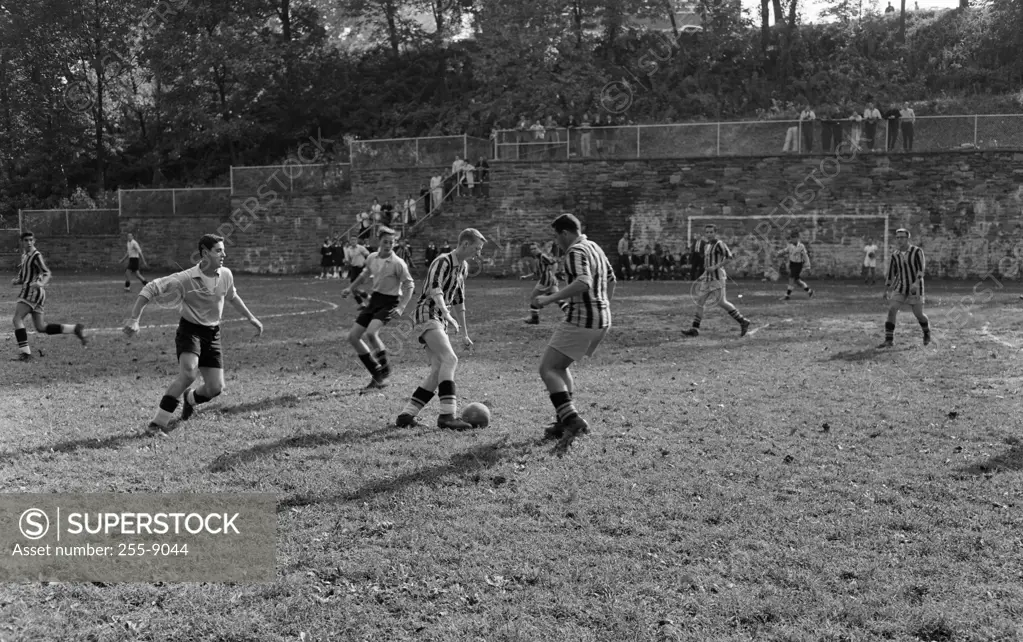 Soccer players playing in soccer field