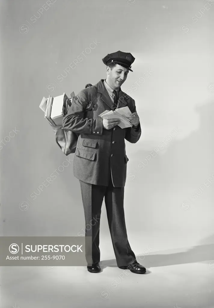 Vintage Photograph. Mailman carrying load of mail. Frame 4