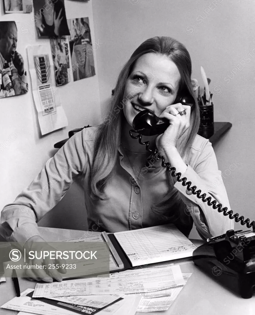 Women with long hair talking on phone