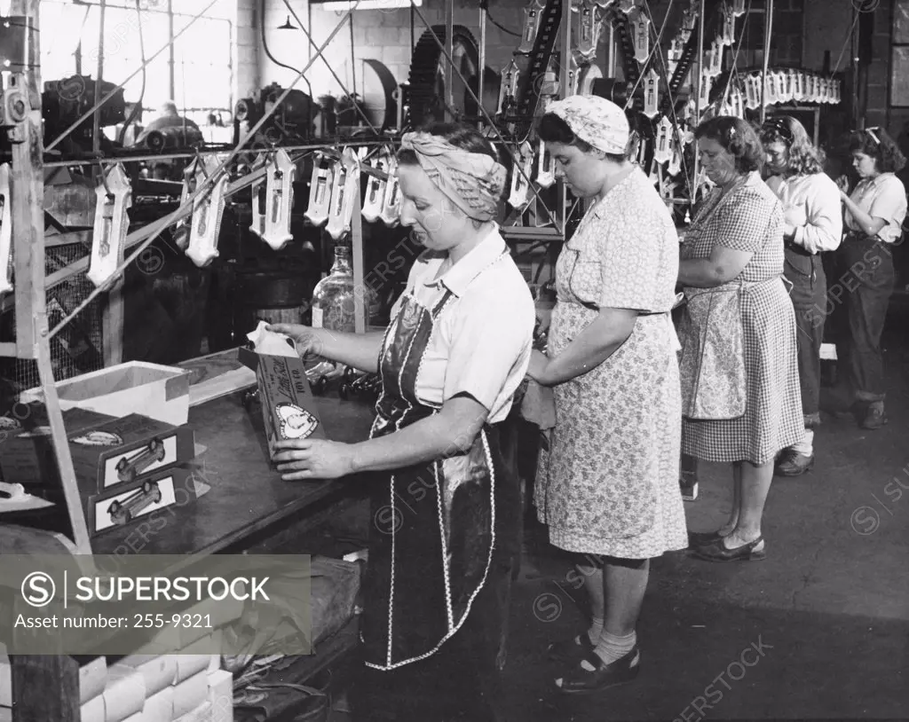 USA, Indiana, female workers working in toy car production line