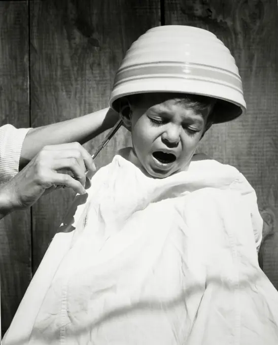 Boy crying during his haircut