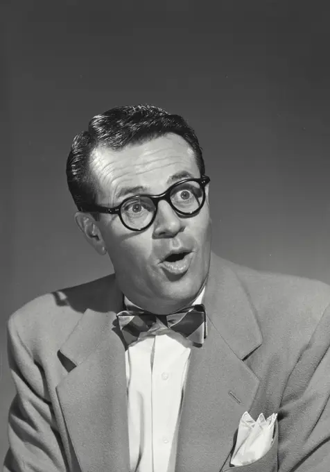 Vintage photograph. Close-up of a businessman looking surprised