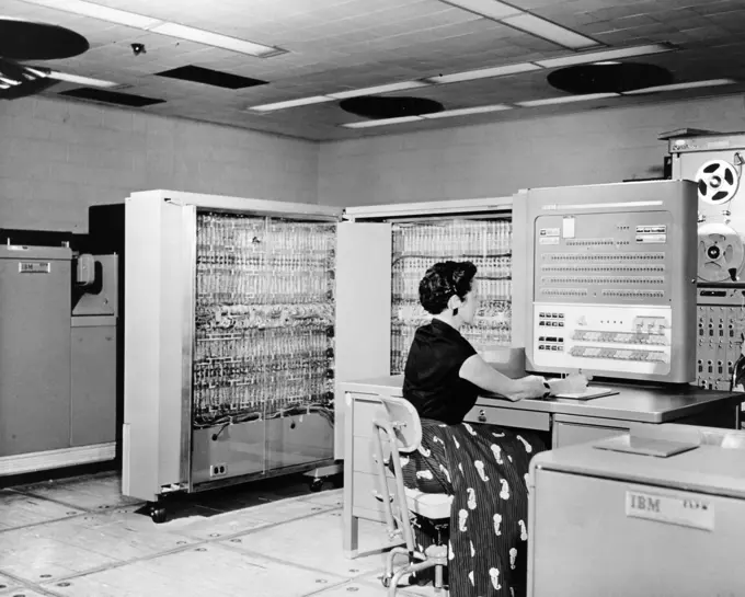 Side profile of a technician working on a computer