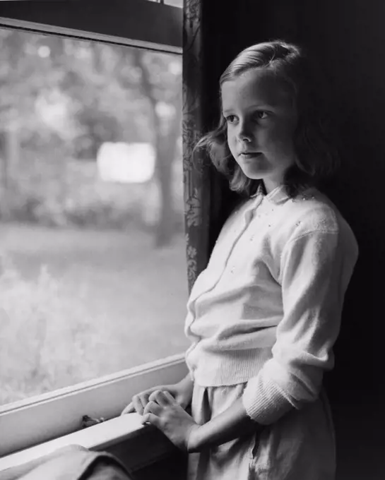 Girl looking out of window