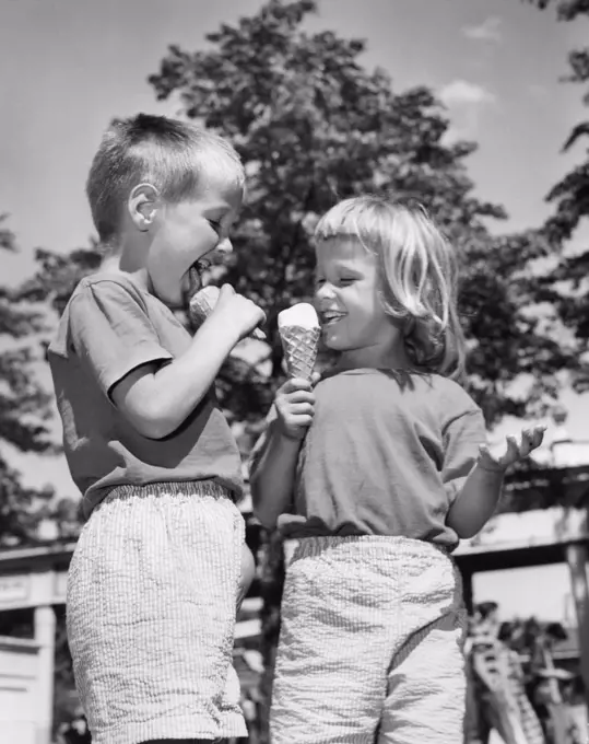 Children eating ice cream cones