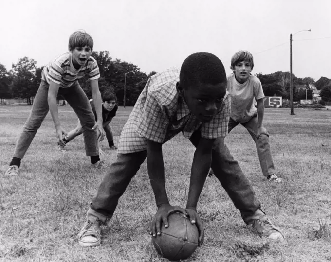 Boys playing american football