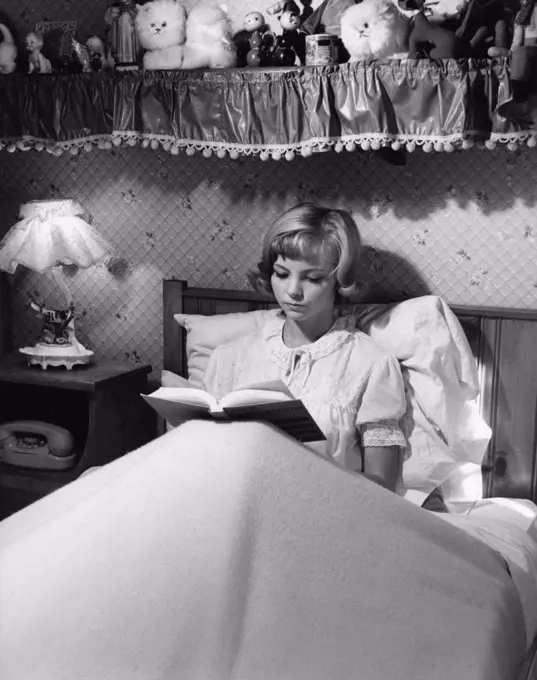 Girl reading in bed