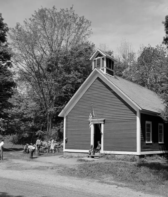 Group of children playing in front of a building, Simonsville, Vermont, USA