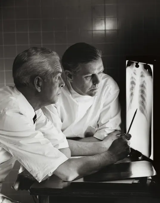 Two doctors examining an X-Ray