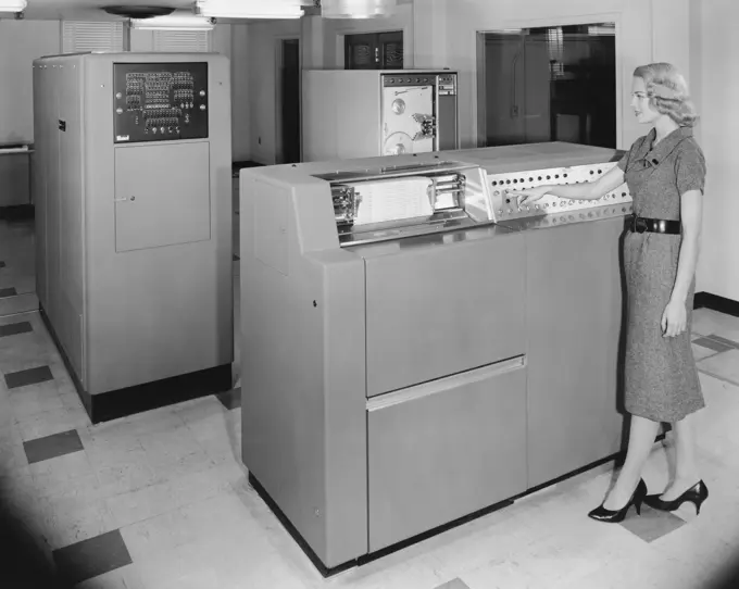 Technician working on mainframe in computer lab, Univac