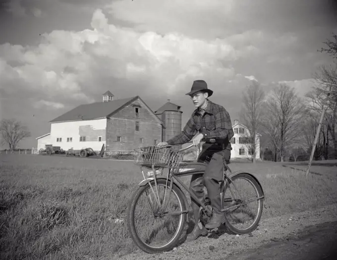 Vintage photograph. Boy on bike in Derry, Massachusetts. New England. Robert Dubeau