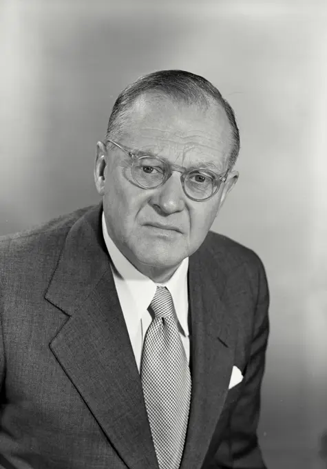 Vintage photograph. Old man and glasses with confused expression looking at camera