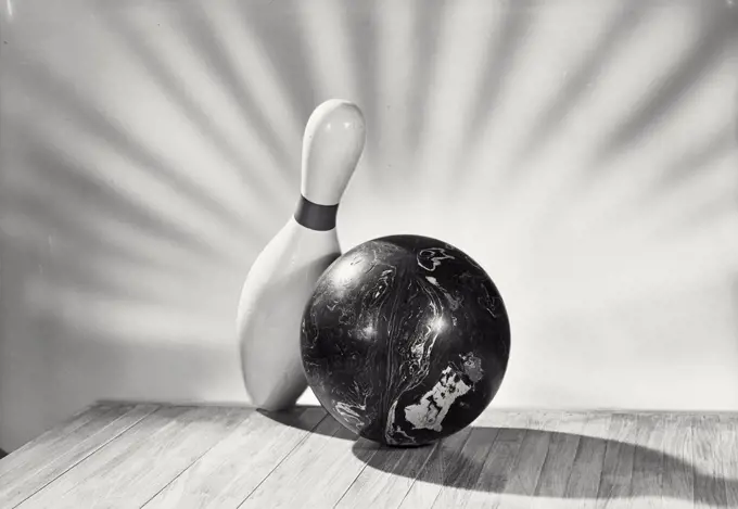 Vintage photograph. bowling ball with single pin