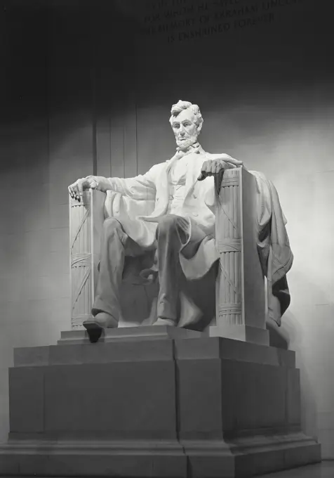 Vintage photograph. Quarter angle front view of Daniel Chester French's statue of Abraham Lincoln in the Lincoln Memorial