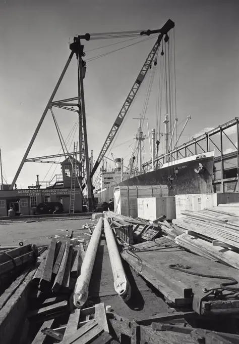 Vintage photograph. Loading of a freighter at dock, New York City