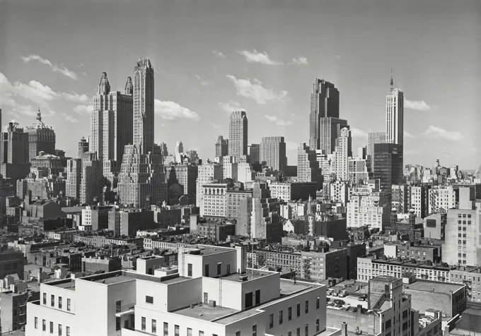 Vintage photograph. Looking south towards Mid Town Manhattan skyline from vicinity of East 57th Street