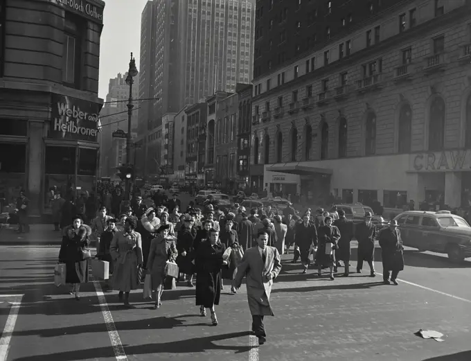 Vintage photograph. Pedestrians crossing the street near 34th Street, New York City