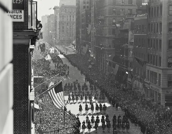 Vintage photograph. Wide shot of Policemen on Horses in Famous New York City Ticker Tape Parade For MacArthur In 1951