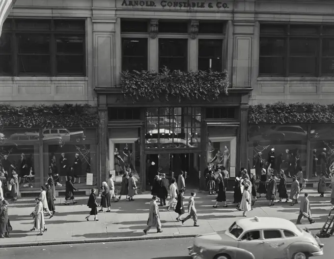 Vintage photograph. Shopping crowds on 5th Avenue in front of Arnold Constable and Company