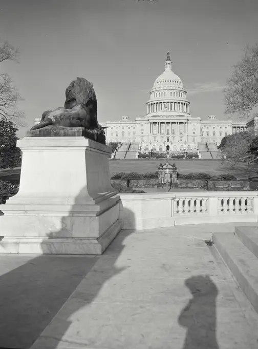 Vintage photograph. capitol building with statue in foreground