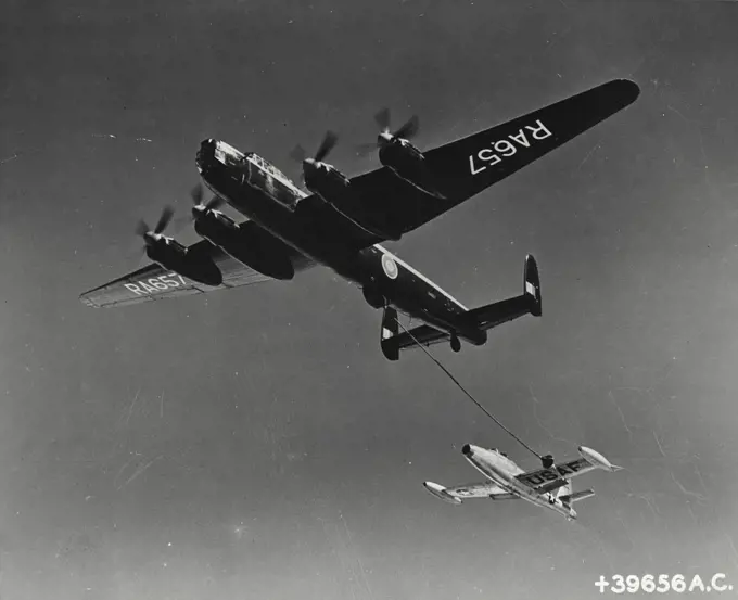 Vintage photograph. Air to air refueling of a USA fighter jet employing the British probe-drogue system